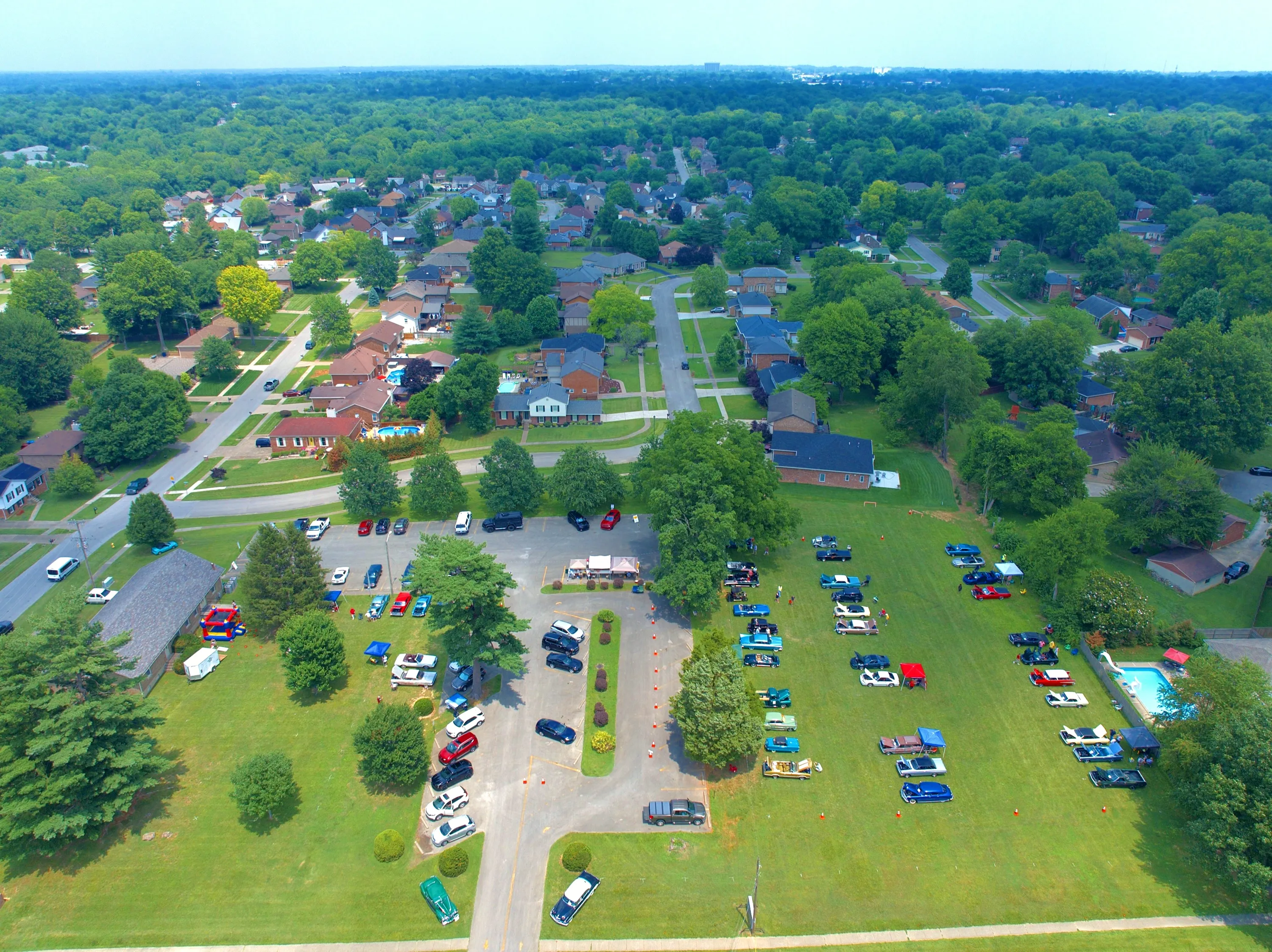 Event footprint — a high establishing view records the full display area and its neighborhood setting.