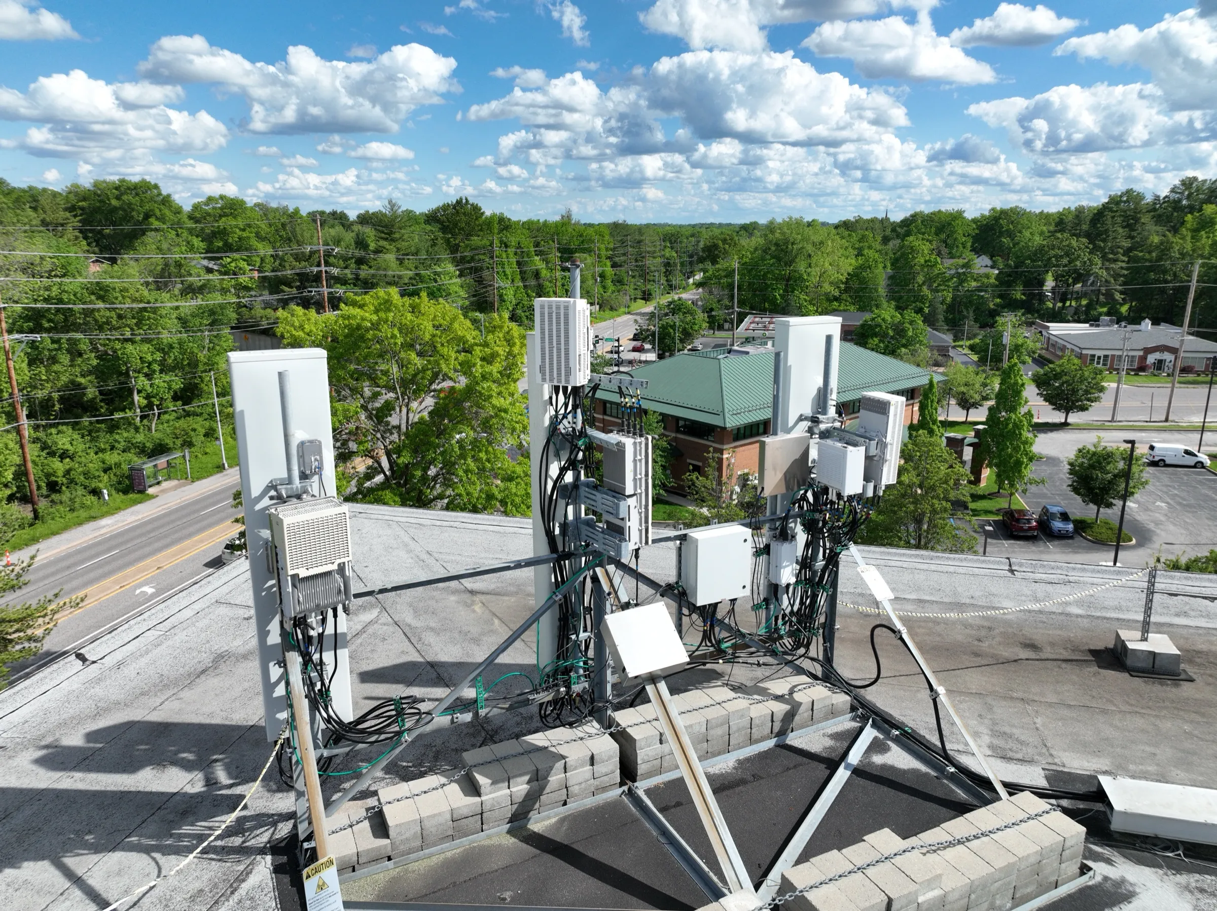 Sector overview — a consistent oblique view captures antennas, radios, mounts, ballast and cable routing together.